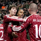 Liverpool’s Alexis Mac Allister (right) celebrates celebrates scoring their side’s third goal of the game with teammate Rio Ngumoha