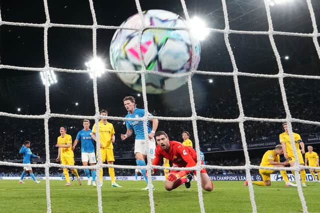 Napoli’s Scott McTominay, centre, scores his first goal against Bodo/Glimt (Alessandra Tarantino/AP)