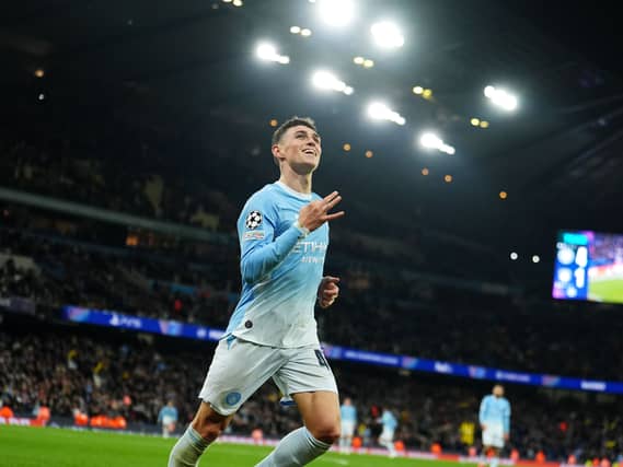 Manchester City’s Phil Foden celebrates scoring a hat-trick