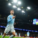 Manchester City’s Phil Foden celebrates scoring a hat-trick