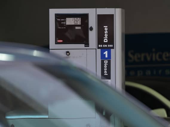 Fuel prices are shown on the pump at 299.9p per litre of diesel
