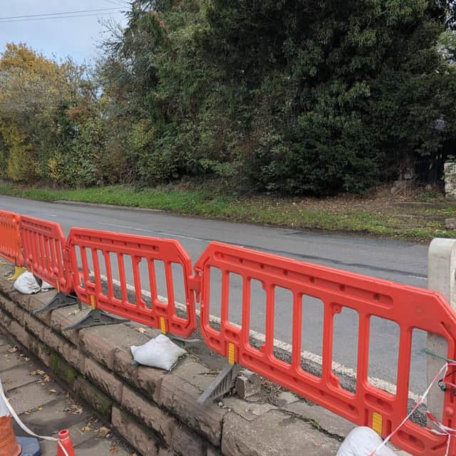 The damaged railings outside the Punch Bowl