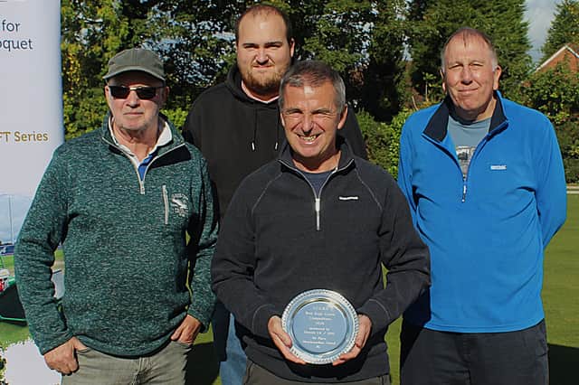 Green for glory – the Wrockwardine Wood team with head man Tony Garmson holding the prize