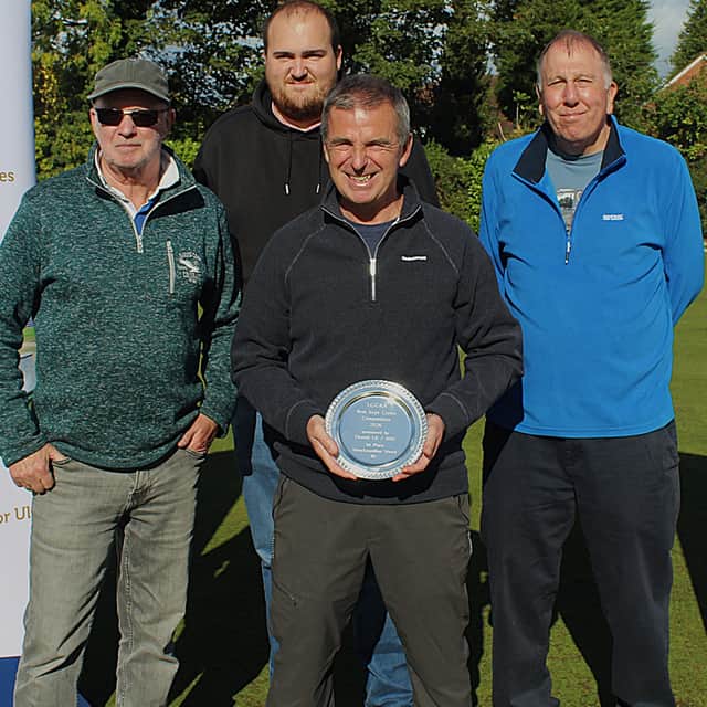 Green for glory – the Wrockwardine Wood team with head man Tony Garmson holding the prize