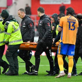 George Lloyd was stretchered off for Shrewsbury on Saturday.