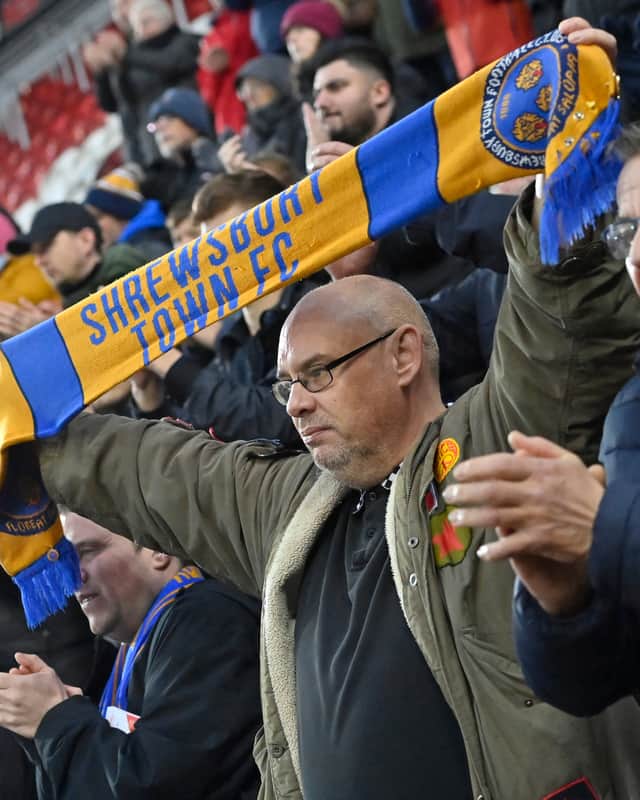 Shrewsbury Town fans cheer on their side at Rotherham United