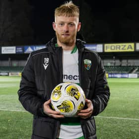 Brad Young with the match ball after The New Saints' 9-0 victory over Ammanford