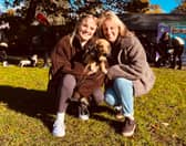 Lauren and Lisa Neal, from Shrewsbury, give Otis a cuddle