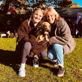 Lauren and Lisa Neal, from Shrewsbury, give Otis a cuddle