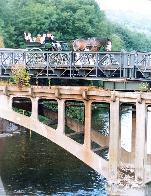 A horse and cart passes over the old Free Bridge at Jackfield on Saturday, August 7, 1993, the last crossing of the bridge before it was closed and demolished. On board and dressed in Edwardian costume were Joe Bowen, Jan Jennings, Peter Benting, Kate Hargreaves, Paul Hall and Jeff Jacques. The metal structure is a Bailey bridge which was laid on top of the deteriorating original concrete in the bridge’s final years.