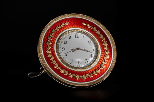 The Fabergé gold mounted and enamelled, circular table clock valued at up to £80,000.
