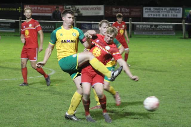 Getting stuck in under the floodlights at Victoria Avenue