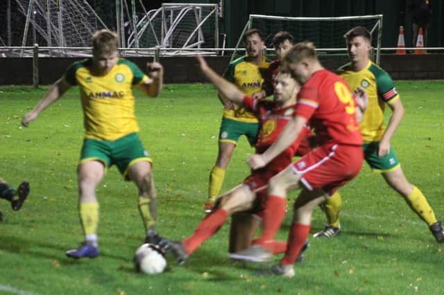 Players get stuck in during Radnor Valley's victory over Llanidloes Town