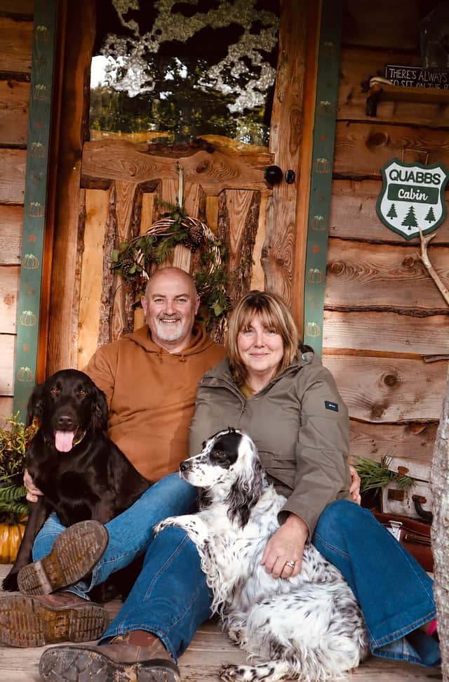 Steph and Paul Macdonald with Sylvie and Wren outside Quabbs Cabin.