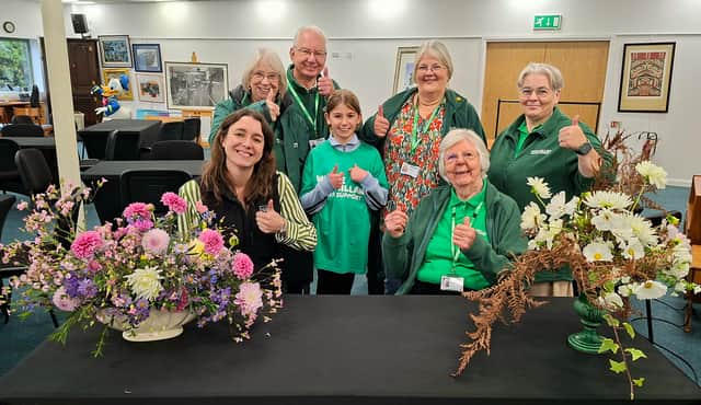 Thumbs up from Maryanne Lineker-Mobberley (seated left) from Halls The Auction House with Shrewsbury Macmillan Fundraising Group supporters.