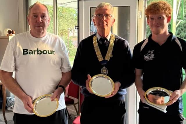 Centenary Doubles winners Dan Powell and (right) Emmet McKinley are seen with league chairman Andy Jones