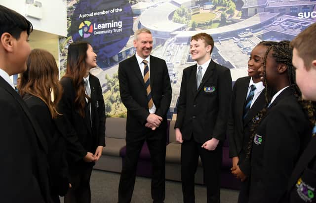 Daniel Roycroft with HLC secondary school students.