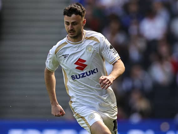 Aaron Collins in action for MK Dons