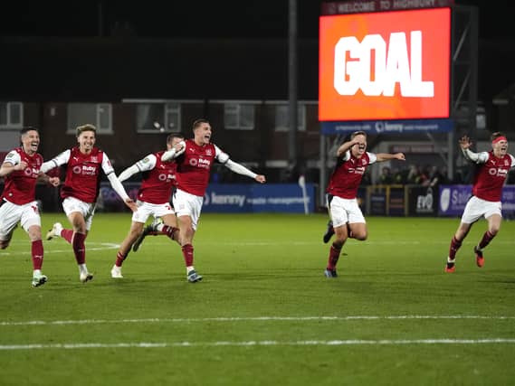 Fleetwood players celebrate their shootout win over Arsenal