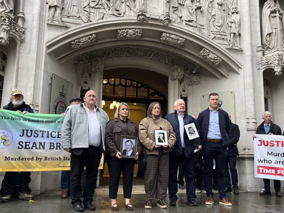 Clare Loughran (front row, second from left) and Siobhan Brown (front row, centre) daughters of Sean Brown outside the Supreme Court in central London