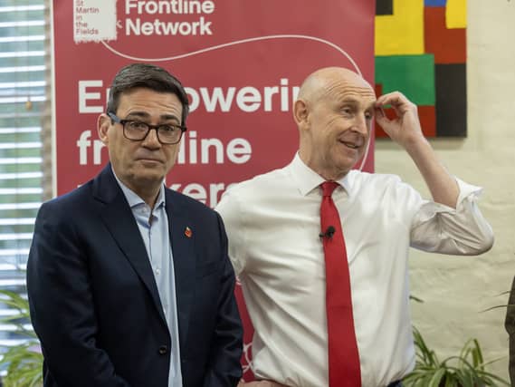 Prime Minister Andy Burnham and Chancellor John Healey during a visit to a homeless charity in London