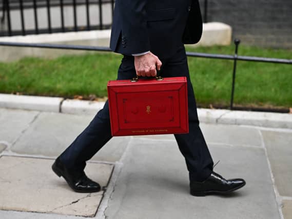John Healey leaves 11 Downing Street, London, with his ministerial red box sen from waist down