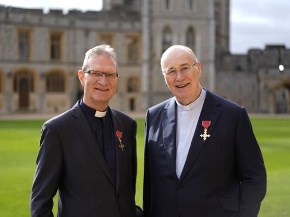 The Very Rev Kenneth Hall (left) and the Right Rev Monsignor Peter O'Reilly, after both were made Officers of the Order of the British Empire (OBE) by the Princess Royal at Windsor Castle, Berkshire