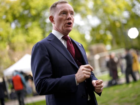 Sir Chris Bryant speaking while standing outside