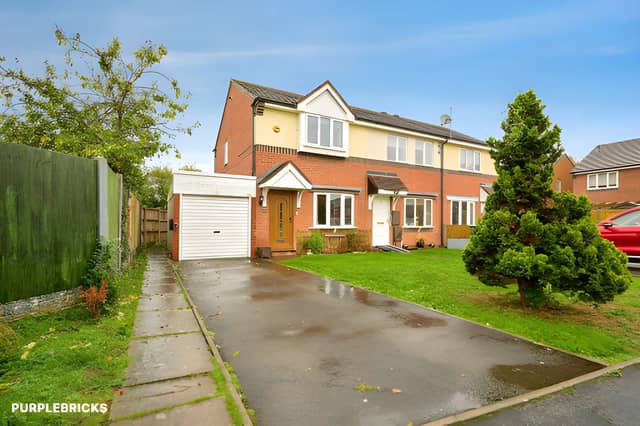 The end-of-terrace house on Barkstone Drive is on the market for £225,000, with a front lawn, driveway, garage and EV charging point adding practical appeal.