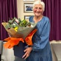 Thank you for everything – Christine Sayers with her gift after stepping down as chairperson
