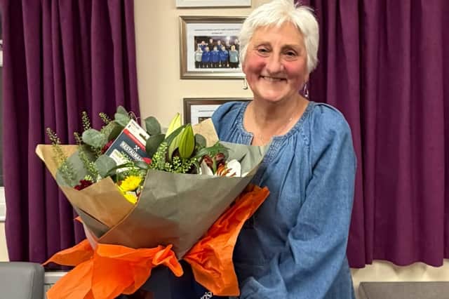 Thank you for everything – Christine Sayers with her gift after stepping down as chairperson