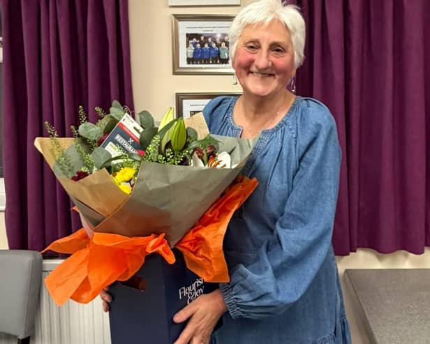 Thank you for everything – Christine Sayers with her gift after stepping down as chairperson