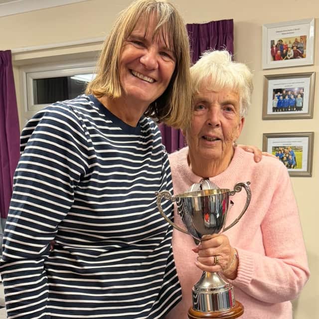 Bowler of the season Tina Ralph receives the Merit trophy from new North Shropshire Ladies president Isobel Jones