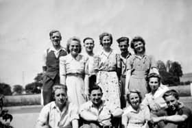 PICTURE FROM THE ARCHIVE: Office staff at Alveley Colliery took a well-earned break in the summer sunshine when they gathered outside the pithead for this group snapshot back in 1948. The 11-strong team, captured smiling on the colliery grounds, traded their paperwork and ledgers for a brief pause in front of the lens. Pictured in the back row are (from left) Tom Cadwallader, Olive Link, Dennis Bache, Doreen Giles, Ted Warrington, and possibly Joan Childs. Taking a seat at the front are (from left) Harold Powell, Wilbur Lloyd, Marie Price (née Robinson), Denise Davies, and Keith Holford.