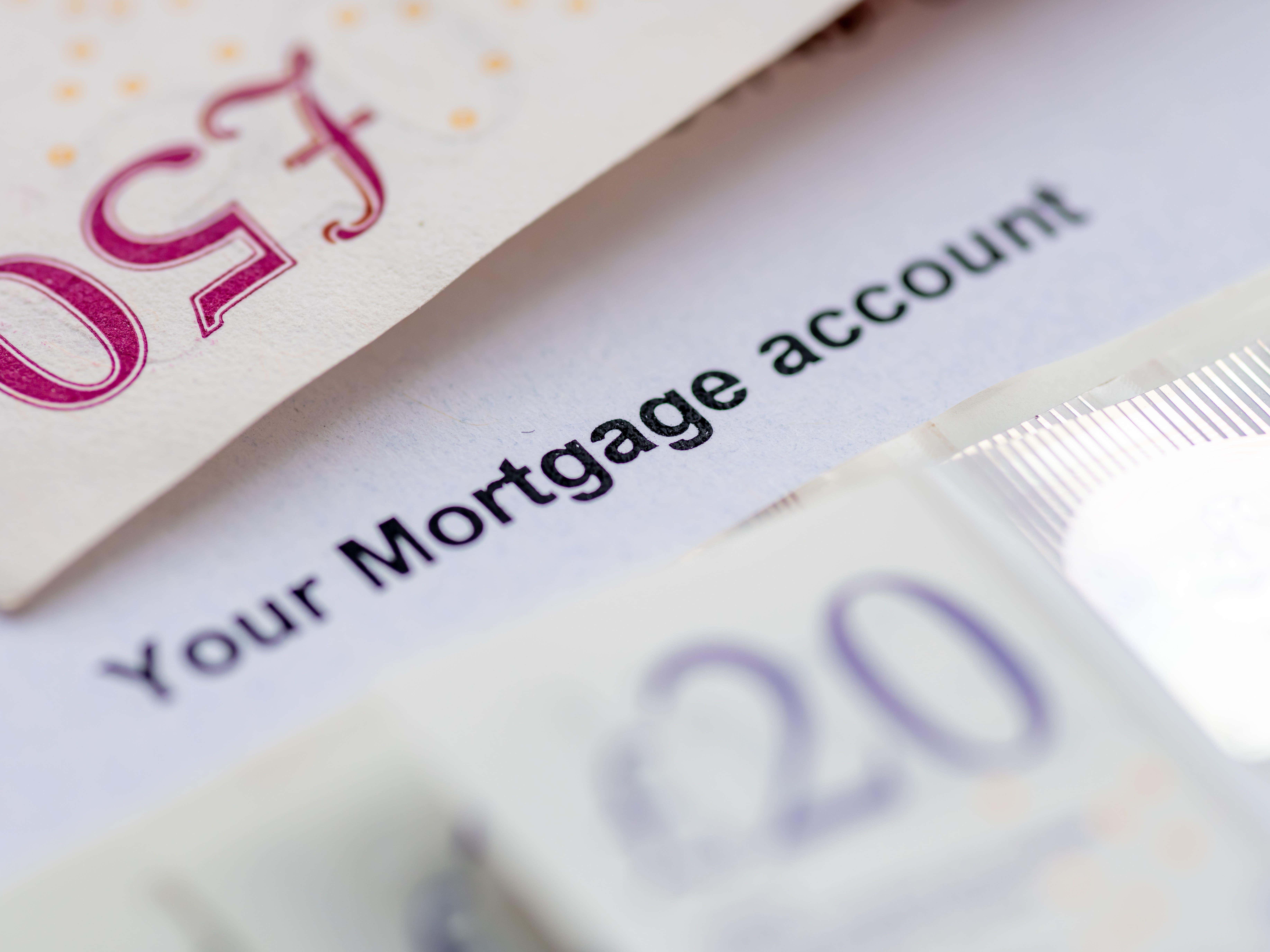 Close up of a mortgage account statement with bank notes