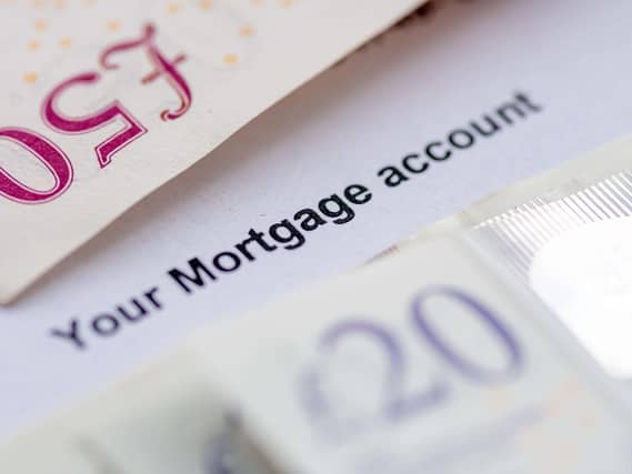Close up of a mortgage account statement with bank notes