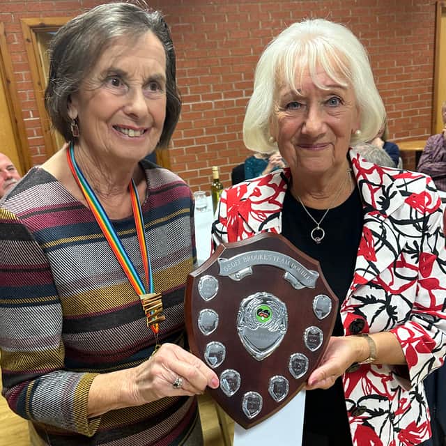 Wem’s winners – Pat Davies receives the Geoff Brookes doubles trophy from president June Davies