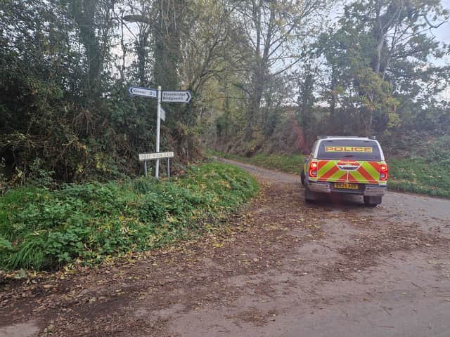 Police at the east end of Sheep Walk Lane near Kinver where a burnt-out car with a body inside was found