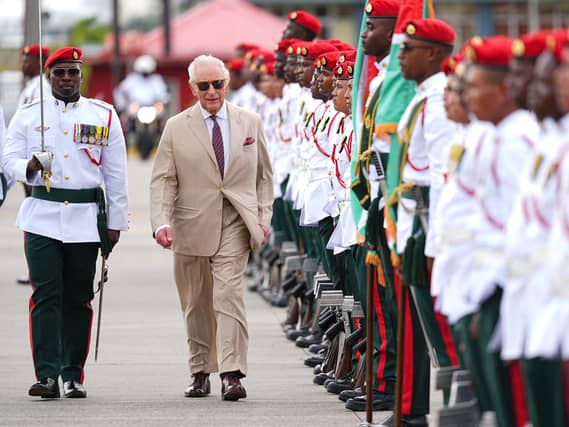 The King inspects a Guard of Honour, formed of members of the Guyana Defence Force