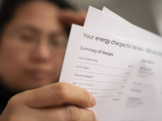 A person looking at their energy bill
