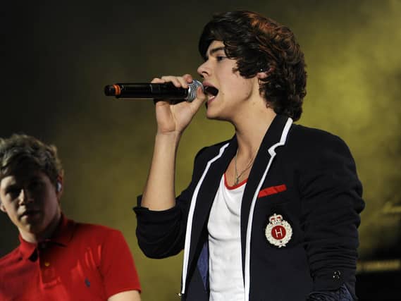 Harry Styles performing on stage