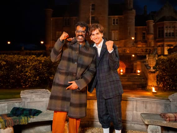 Romesh Ranganathan and Sebastian Croft outside the Traitors castle