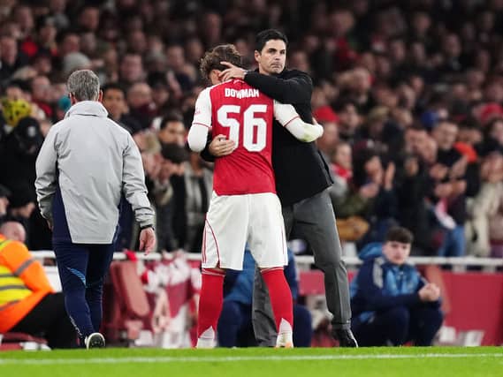 Arsenal manager Mikel Arteta (right) embraces Max Dowman