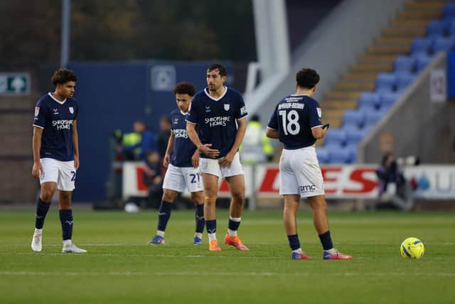 Dejected Shrewsbury Town players after Gillingham score their second goal