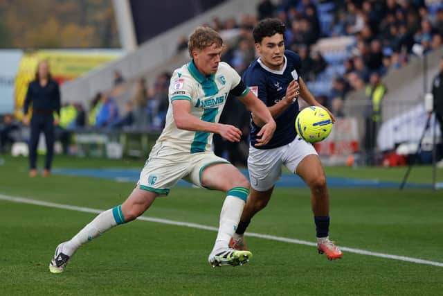 Kian McMahon-Brown of Shrewsbury Town battles with Gillingham’s match-winner Andy Smith 