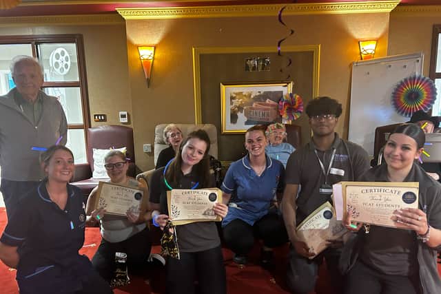 Students showing off their appreciation certificates
