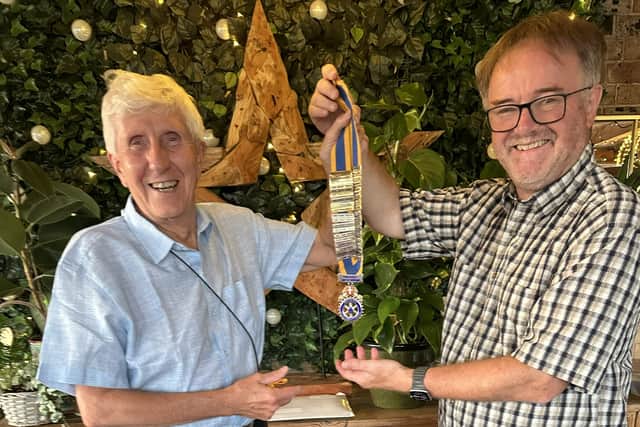 Brian Aston (left) takes the Borderland Rotary chain of office from Steve Jerman