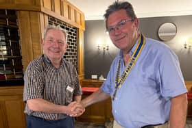Paul Serrell-Cooke (right) receives the presidential chain of office from outgoing president Tom Hunt.