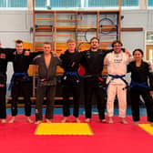Left to right: Jack Robbins (blue belt), Tom Morris (black belt), Josh Alderson (blue belt), Simon Pearce (black belt), James Moss (blue belt), Owain Williams (black belt), Craig Coleman (blue belt), Melissa Davies (blue belt)