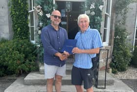 Sean Evans (left) receives the Paul Harris Fellowship Award from Borderland president, Brian Ashton 